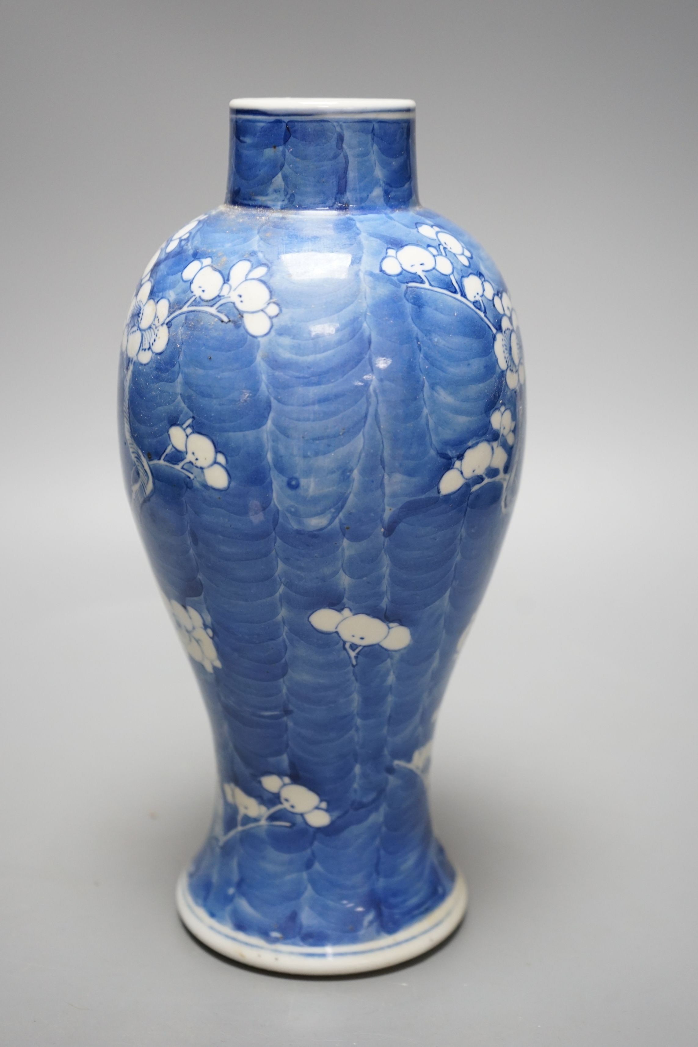 A late 19th century Chinese blue and white ‘prunus’ vase, 25cms high